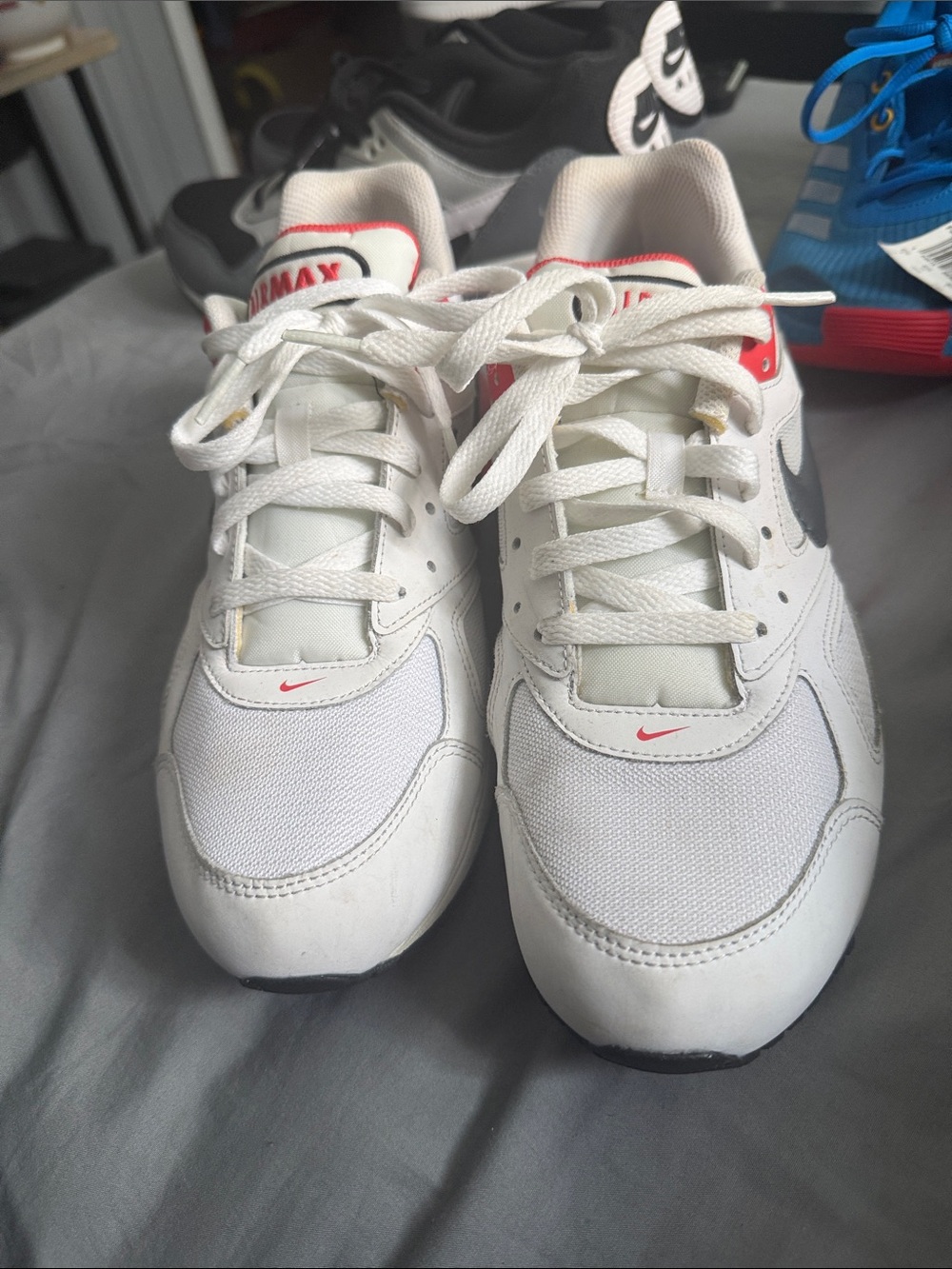 Nike White Sneakers with Red Accents and Black Swoosh